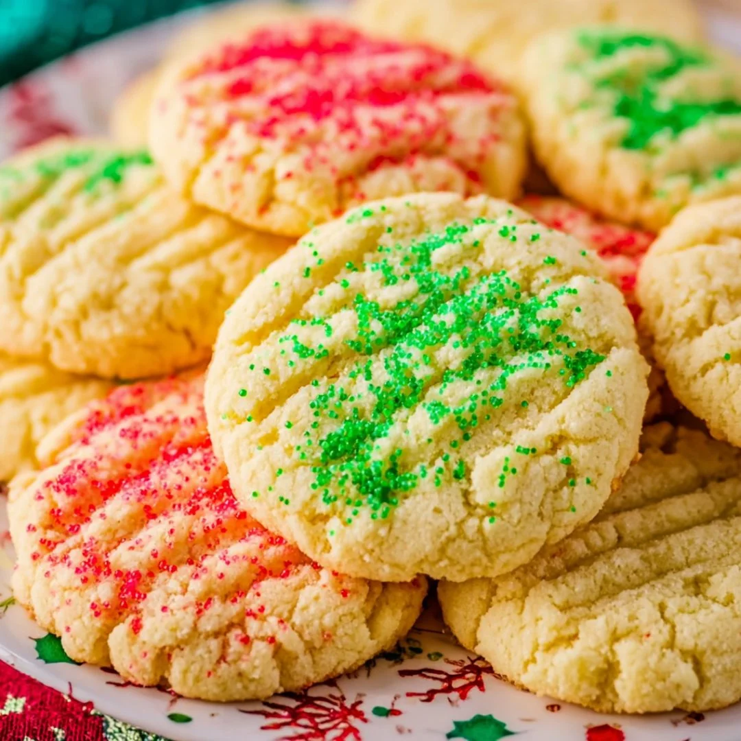 Decorated Christmas sugar cookies in festive shapes and colors.