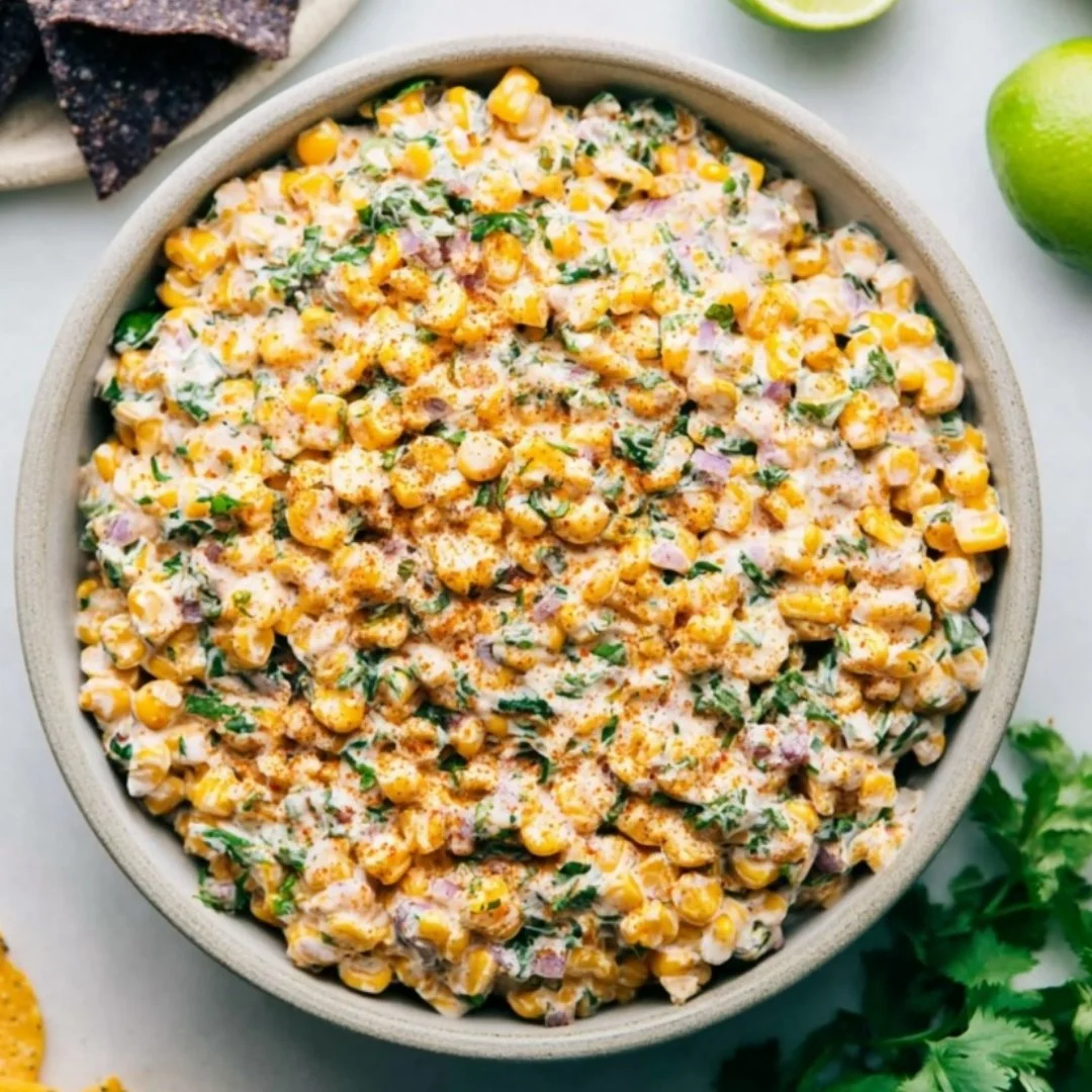 Creamy Mexican Street Corn Dip with cheese and spices served in a bowl