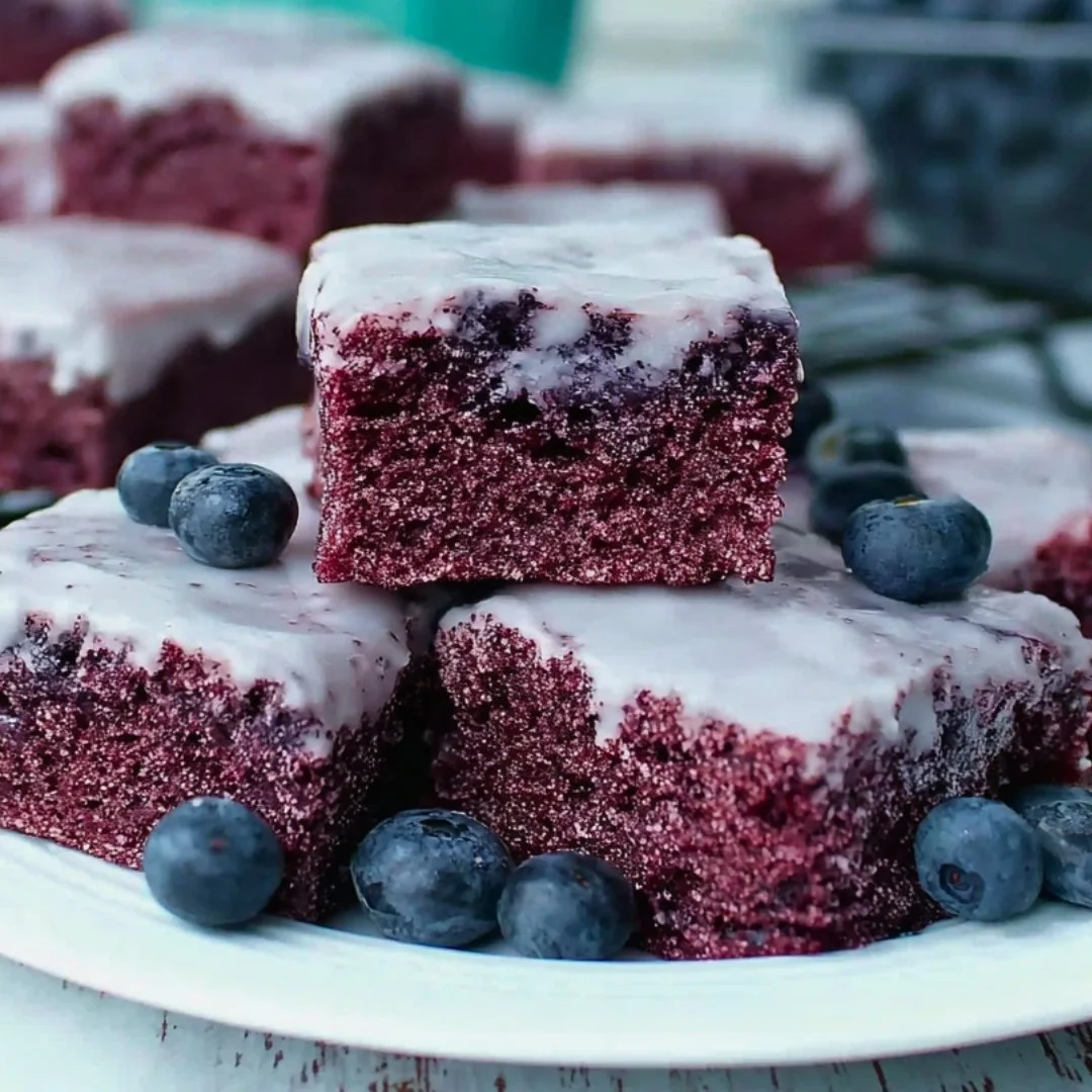 Blue_Salt_Trick_for_Men_Recipe_05 A bright, fizzy blue beverage with granulated salt crystals and a clear jar on a granite surface.