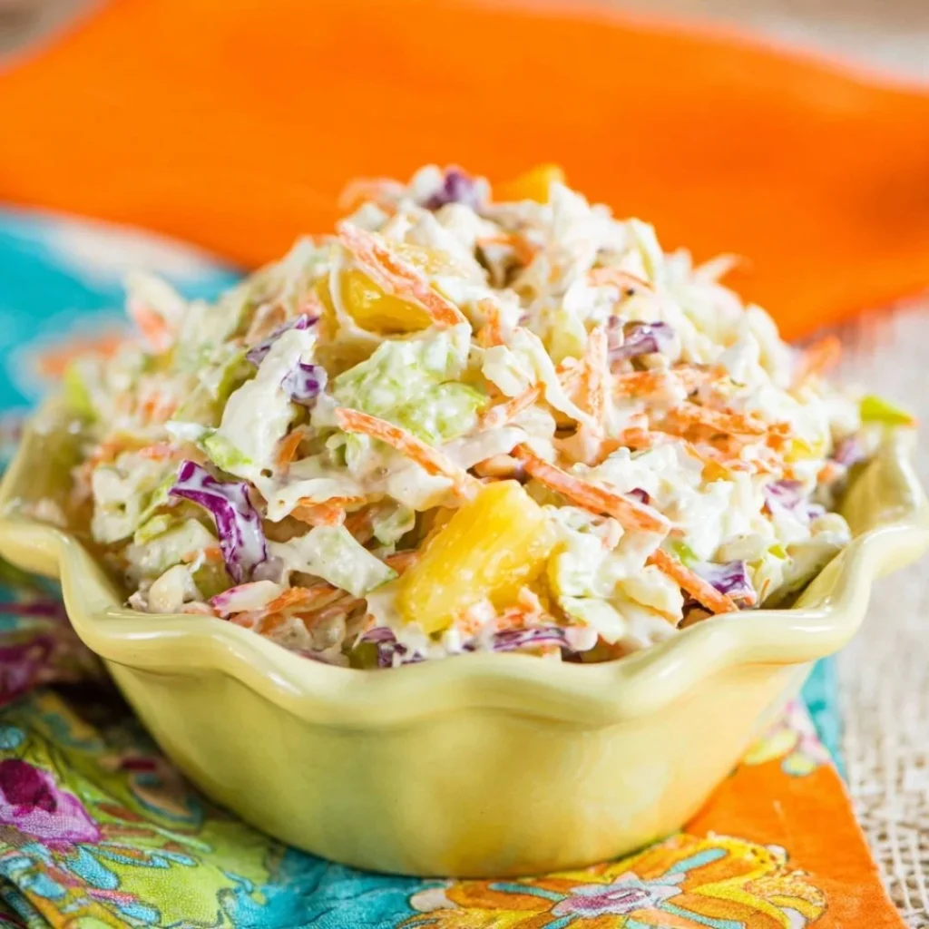 A bright, fizzy blue beverage with granulated salt crystals and a clear jar on a granite surface.