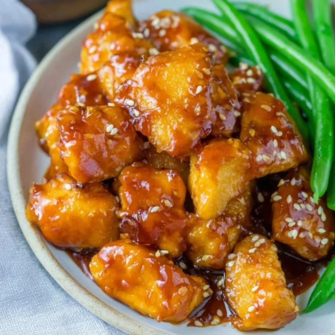 Healthy orange chicken dish featuring vibrant colors and fresh ingredients