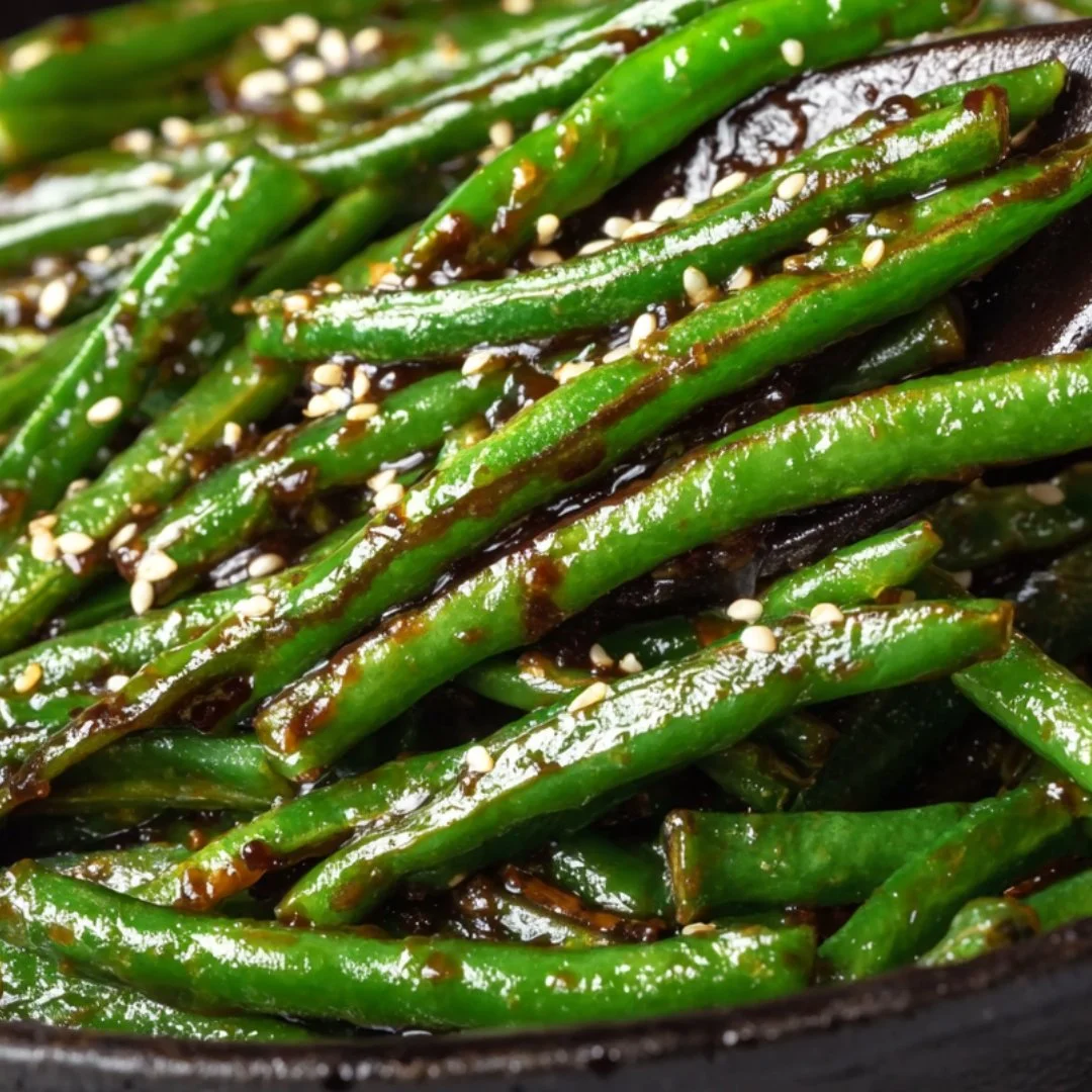 Stir-fried Chinese green beans with garlic and sesame in a bowl.